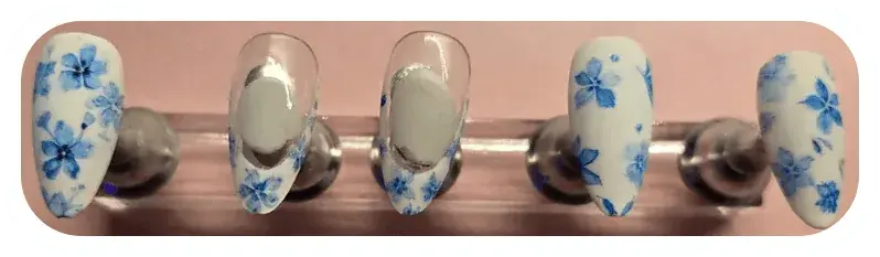 Blue watercolour flower nails I designed and hand-painted. Read about my nail art